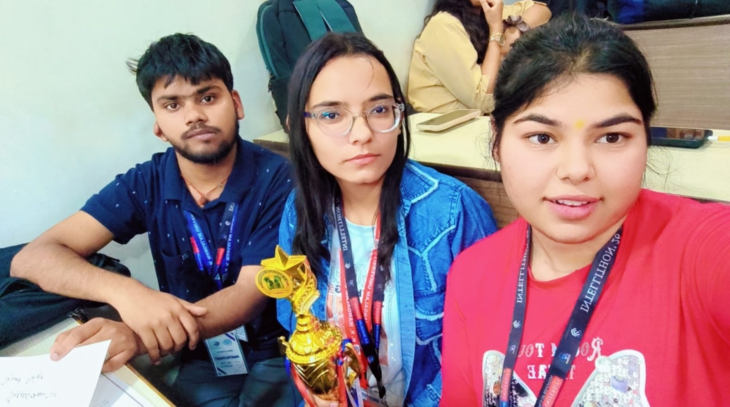 Team members with the INTELLITHON 2026 trophy